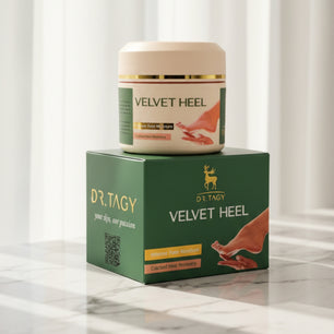 Velvet Heel cream jar from Dr. Tagy placed on top of its green box with a soft indoor background.
