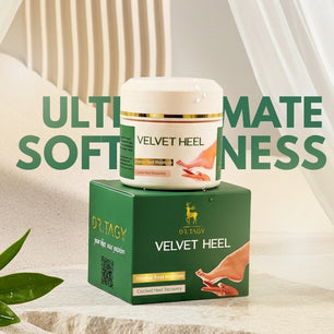 Dr. Tagy Velvet Heel Foot Care Cream and box packaging displayed on a soft fabric surface with the text “Ultimate Softness,” highlighting hydration, repair, and smooth skin results.